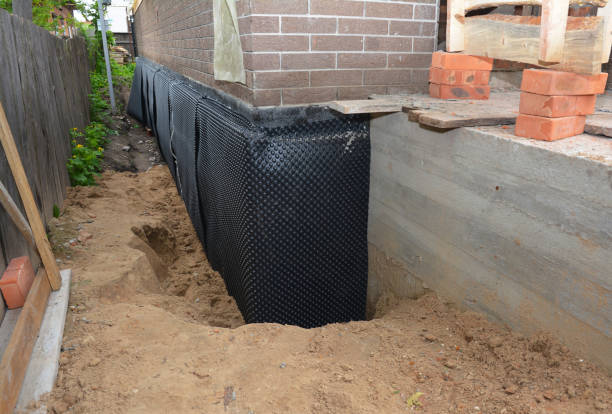 Happy homeowners after waterproofing job in Sparta